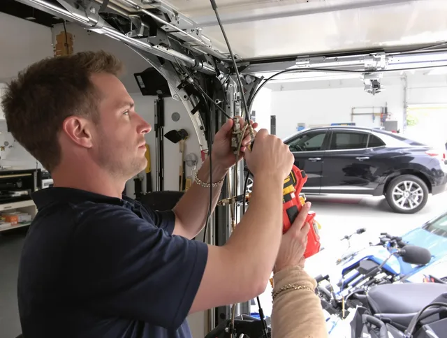 Middletown Garage Door Repair safety certified technician performing cable replacement in Middletown